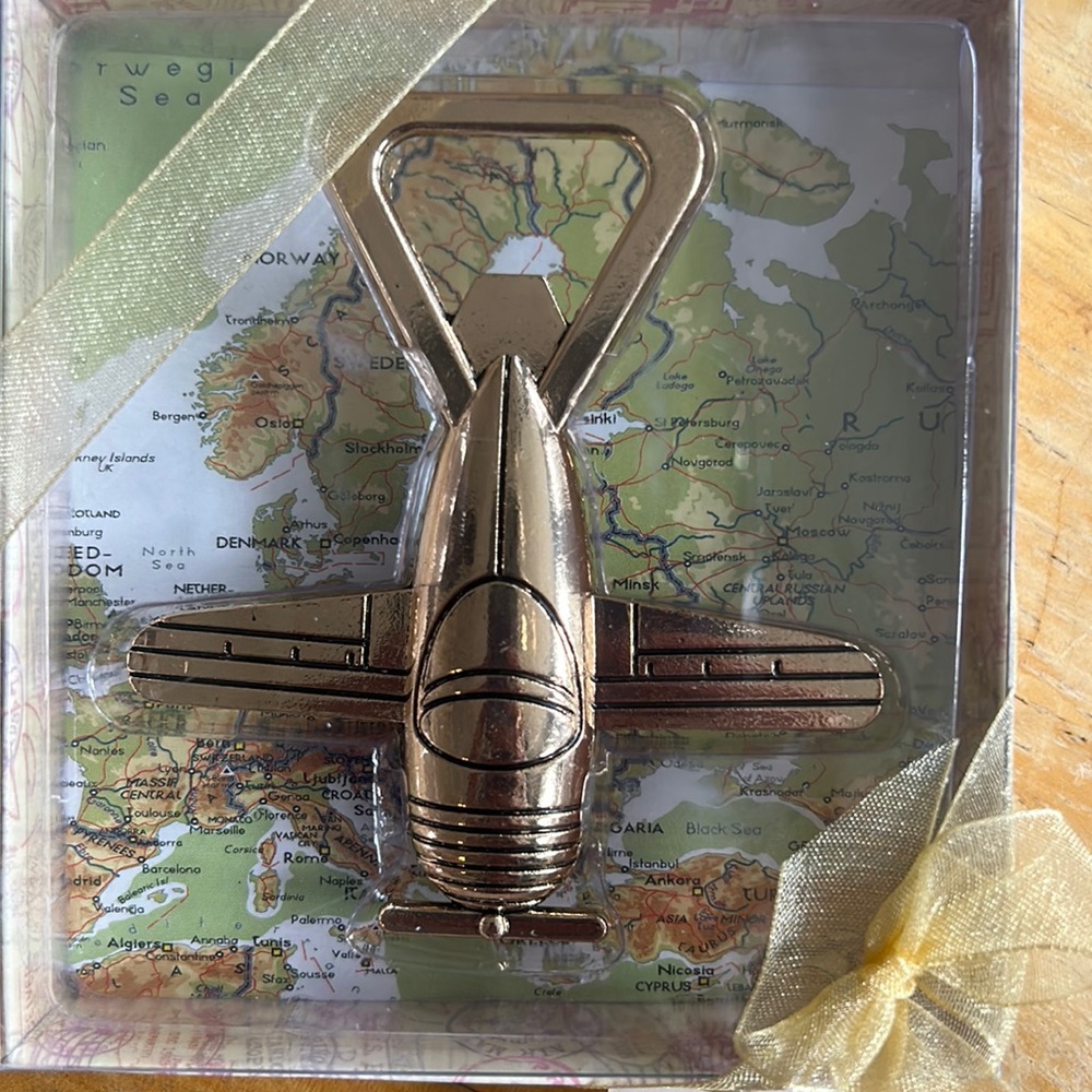 NIB “airplane” gold metal bottle opener